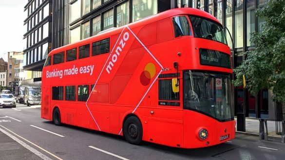 A London double-decker bus with the Monzo design on it